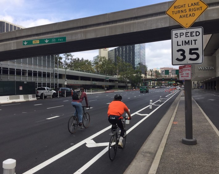 Sometimes one narrow lane isn't enough for two cyclists riding togehter