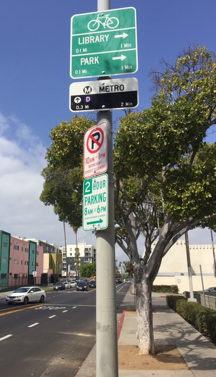 7th Street Bikeway signage includes the distance to the nearby Metro D Line subway