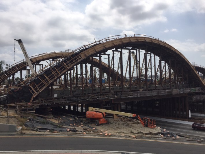 Newly poured arches over the 101 have been wrapped