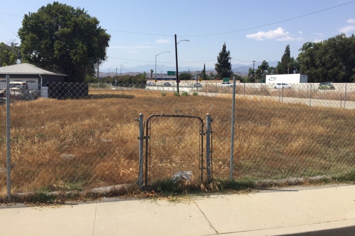 Undemolished gate is all that remains of a former home along the SR-71