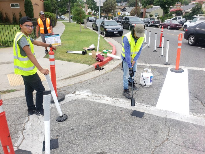 A blow torch was used to install the bollards for the curb extensions at Poplar Boulevard and South Meridian Avenue and Winchester Drive. Kristopher Fortin/Streetsblog LA