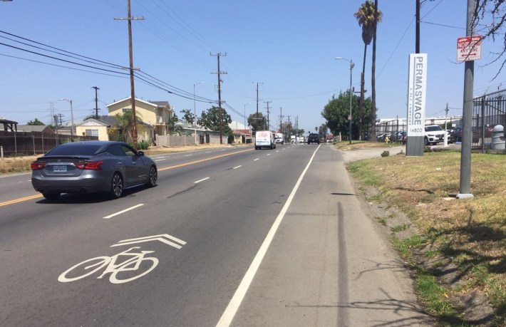 What engineer expects cyclists to share the lane here (on Figueroa Street) instead of just riding in the bike-lane-sized area to the right of the car lane?
