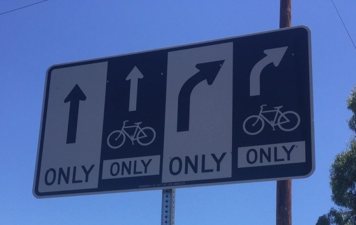 Can anyone identify where this new bikeway right turn signage is located?