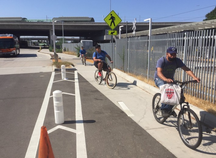 New two-way protected bike lanes extend along Willowbrook Avenue south from Rosa Parks Station