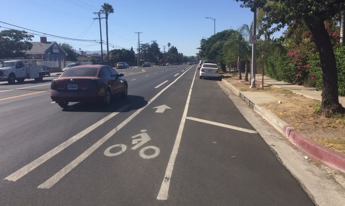 In February, LADOT upgraded this stretch of Woodman - adding a buffer (the dotted line) to the existing bike lane.