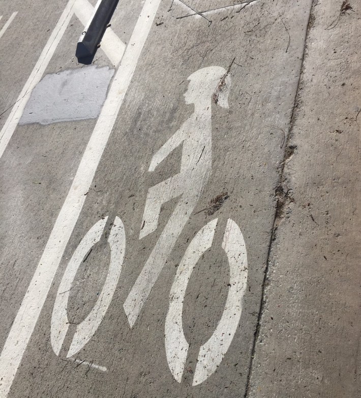 Many of the bike lane markings feature a pony-tailed presumably female cyclist