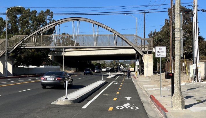 The new bikeway goes under the 1974 pedestrian bridge built where