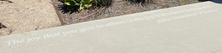 Quote from Whittier's namesake poet in the sidewalk at Oak Station