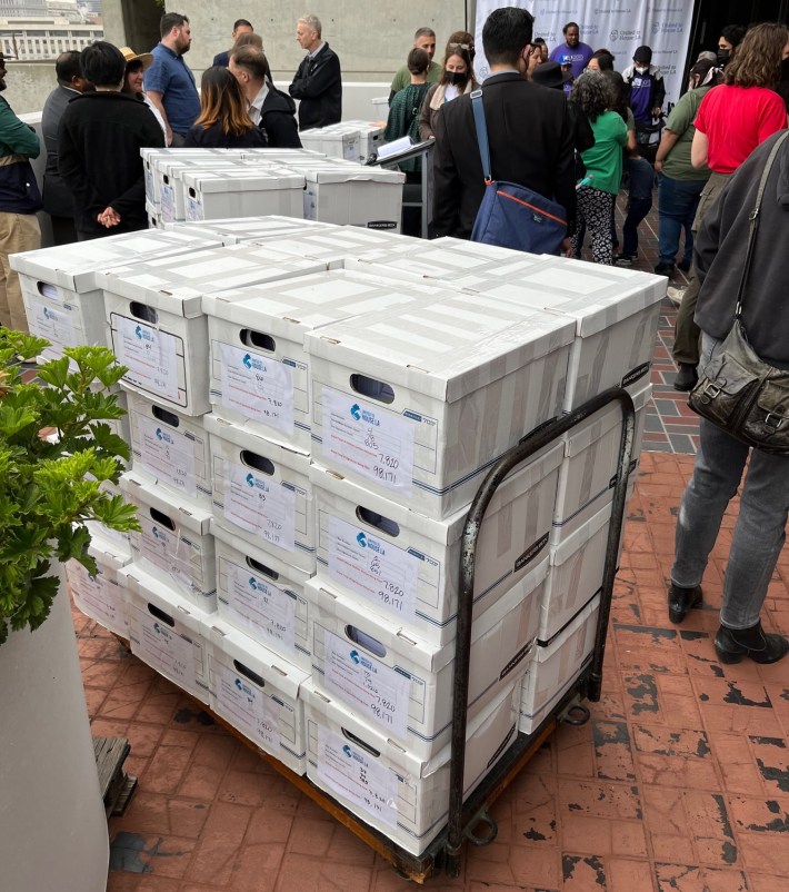 United to House L.A.'s 98,171 signatures atop four pallets