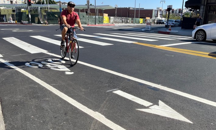 First Street bike lanes, with nearly completed Little Tokyo Regional Connector subway station in background
