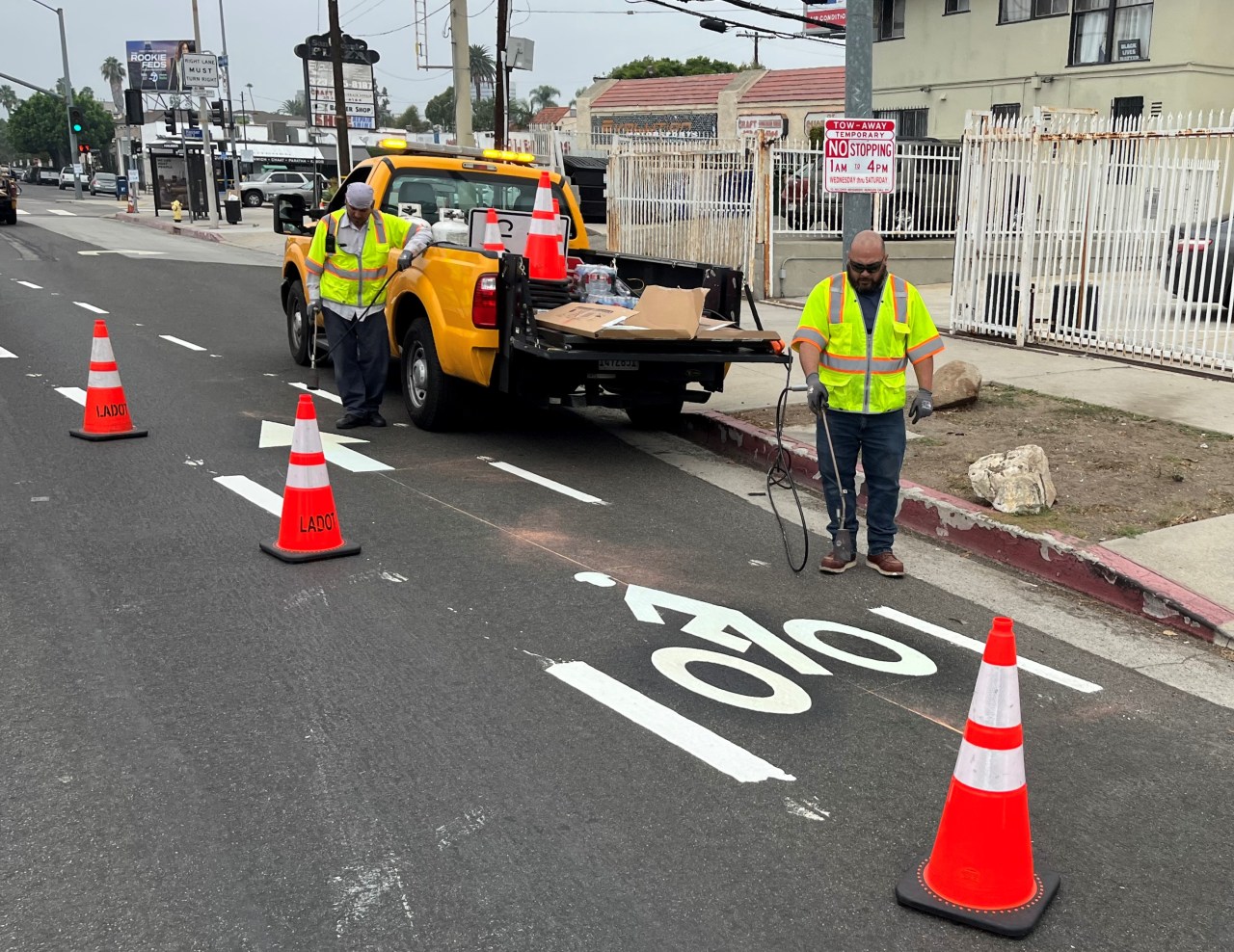 LADOT crew out this morning adding thermoplastic bike symbols to the new lanes