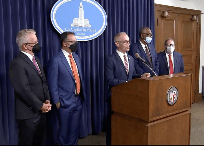 Screen grab from the press conference broadcast by ABC7. Councilmembers from left to right: Paul Krekorian, Bob Blumenfield, council president pro tem Mitch O'Farrell, Curren Price, and Paul Koretz. They gathered to call for the resignations of holdouts Gil Cedillo and Kevin de León.