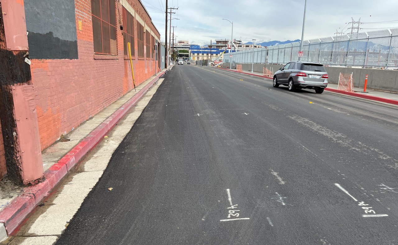Bike lanes (preliminary markings visible) continue on Center Street, which really needs a sidewalk on the left. On the right is Metro construction for the Division 20 Portal Widening and Turnback Facility Project, and new emergency operations center.